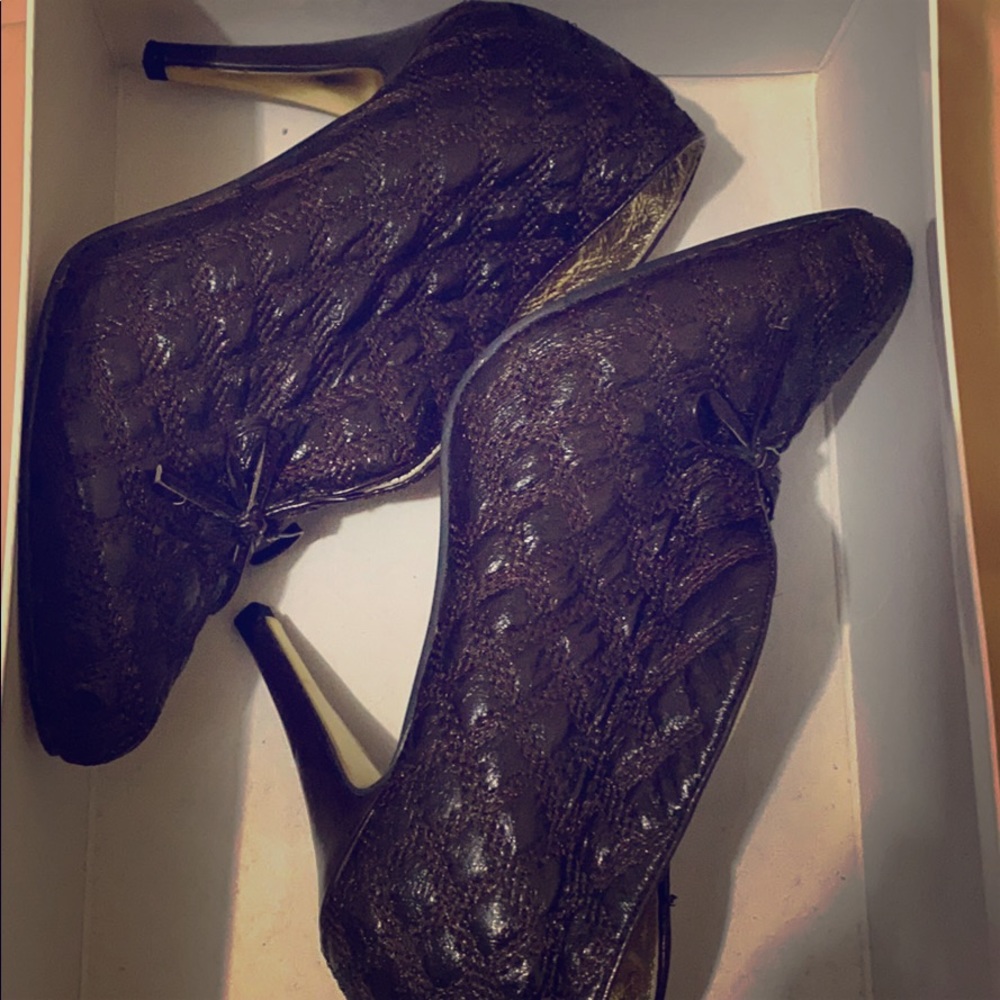 Brown XOXO booties.